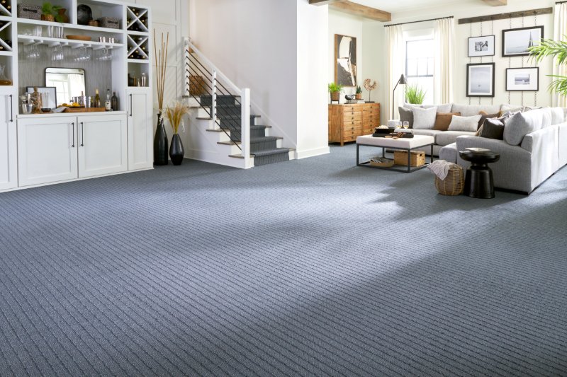 Blue striped Karastan carpet in a coastal style living room