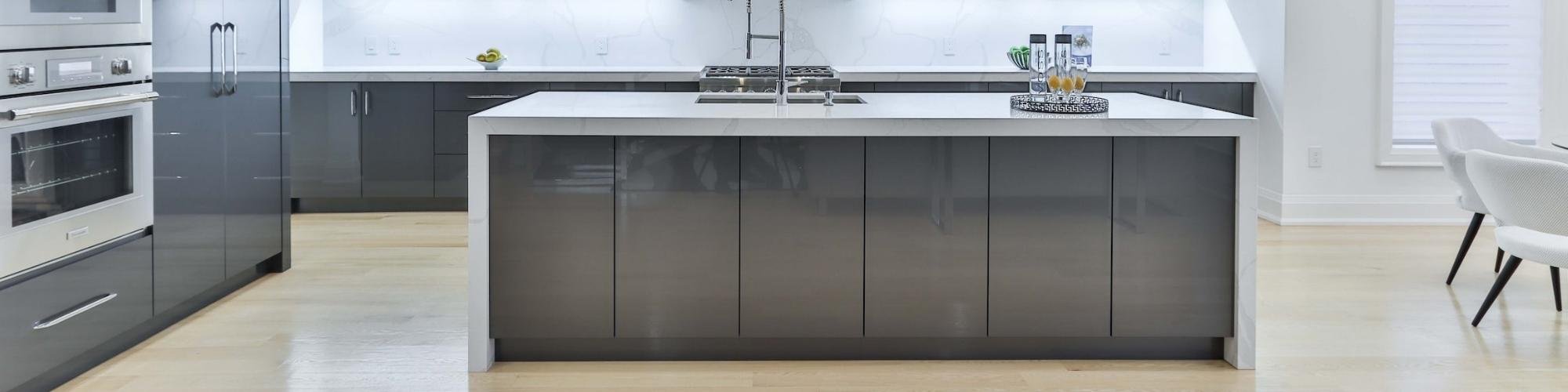 Modern kitchen with light LVP floors from Manufacturer's Carpet & Flooring